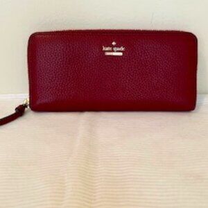 KATE SPADE JACKSON ST ZIP AROUND WALLET IN FIGJAM